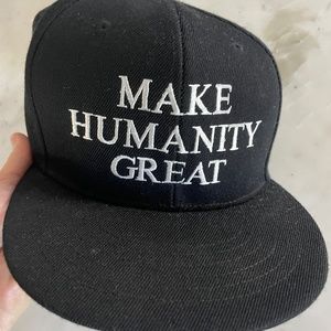 Corie Mattie MAKE HUMANITY GREAT with embroidered bird Trucker Hat